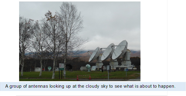  ,A group of antennas looking up at the cloudy sky to see what is about to happen.